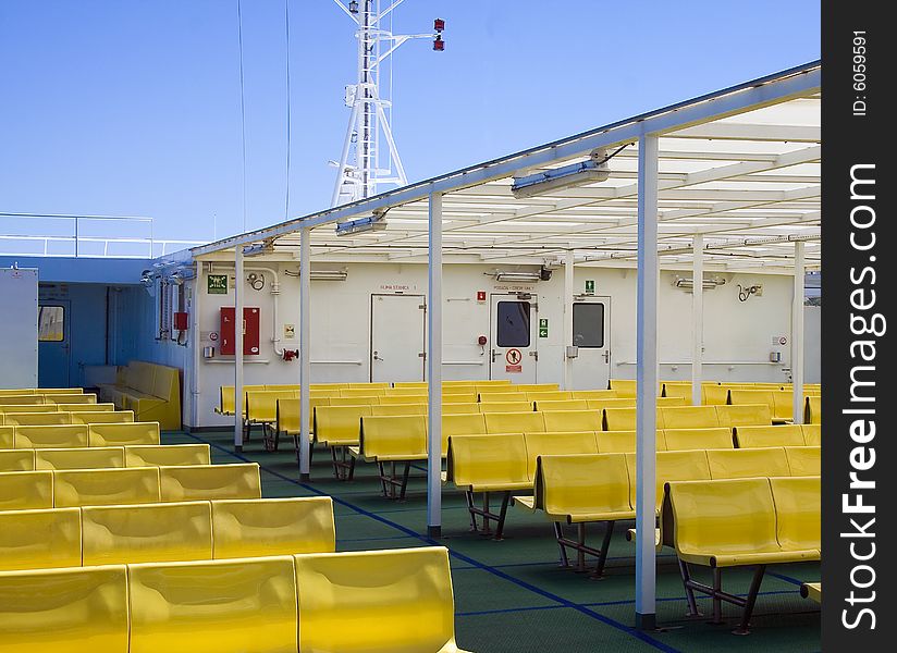 Yellow benchs on a ferryboat