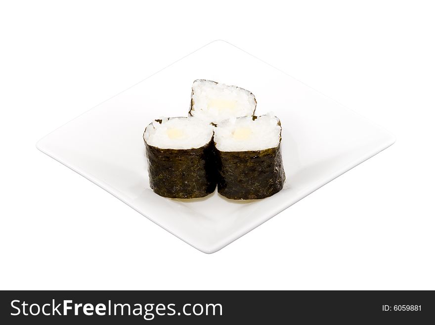 A square white plate with three pieces of sushi