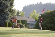 Couple Playing Golf - Horizontal Royalty Free Stock Image