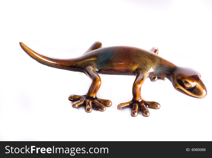 Colourful toy iguana isolated ona white background