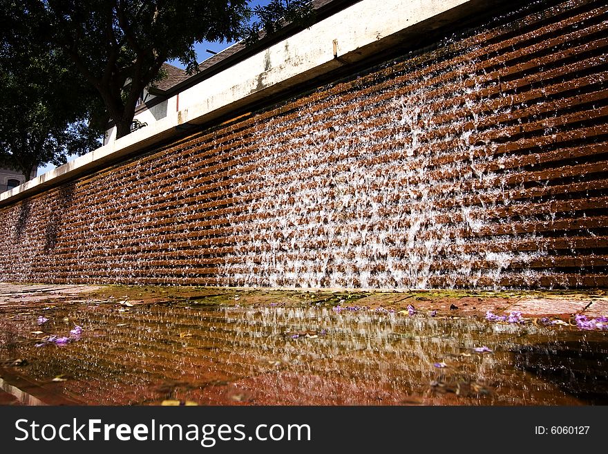 Water cascading down a brick wall. Water cascading down a brick wall.