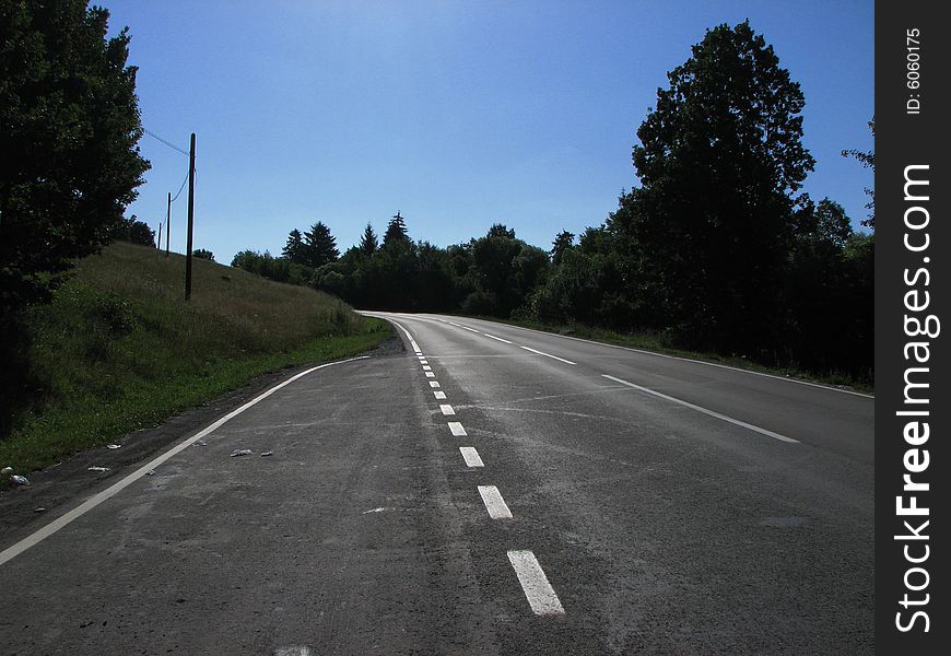Road in Transylvania with blue sky