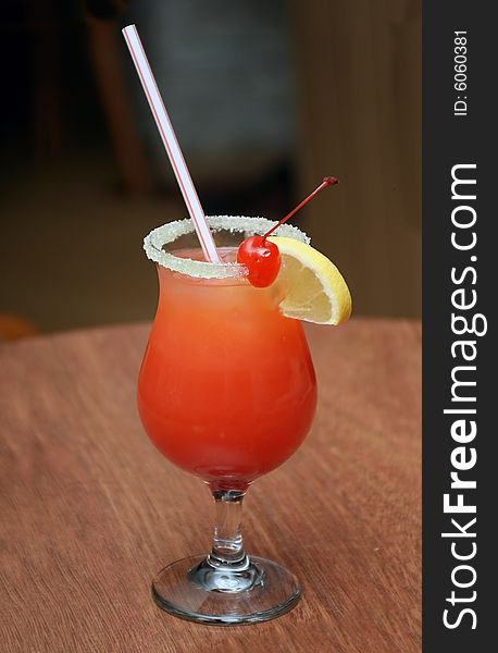 Cocktail with fruits in the wineglass