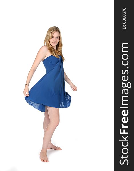 Woman in blue dress twirling around