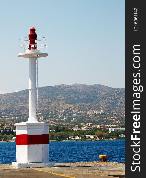Lighthouse in harbor of St. Nicolas. Crete. Greece