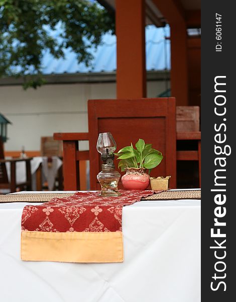 Close-up of a table with a glass lantern. Close-up of a table with a glass lantern.