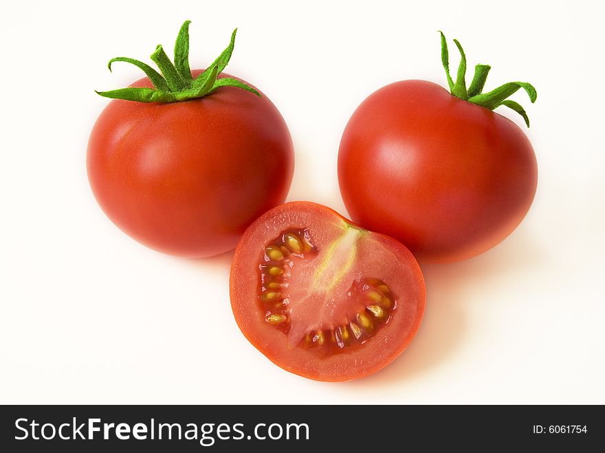 Red ripe tomatoes on the white background. Red ripe tomatoes on the white background