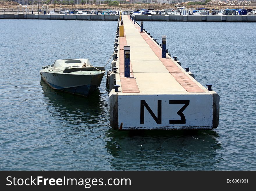 Speedboat docked at a Jetty. Speedboat docked at a Jetty