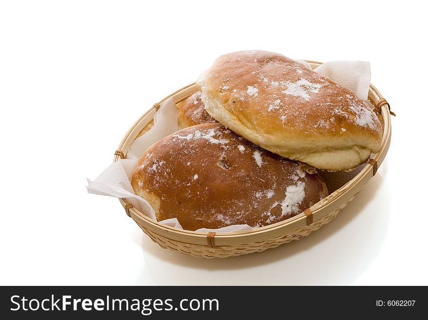 Fresh baked rolls on white background