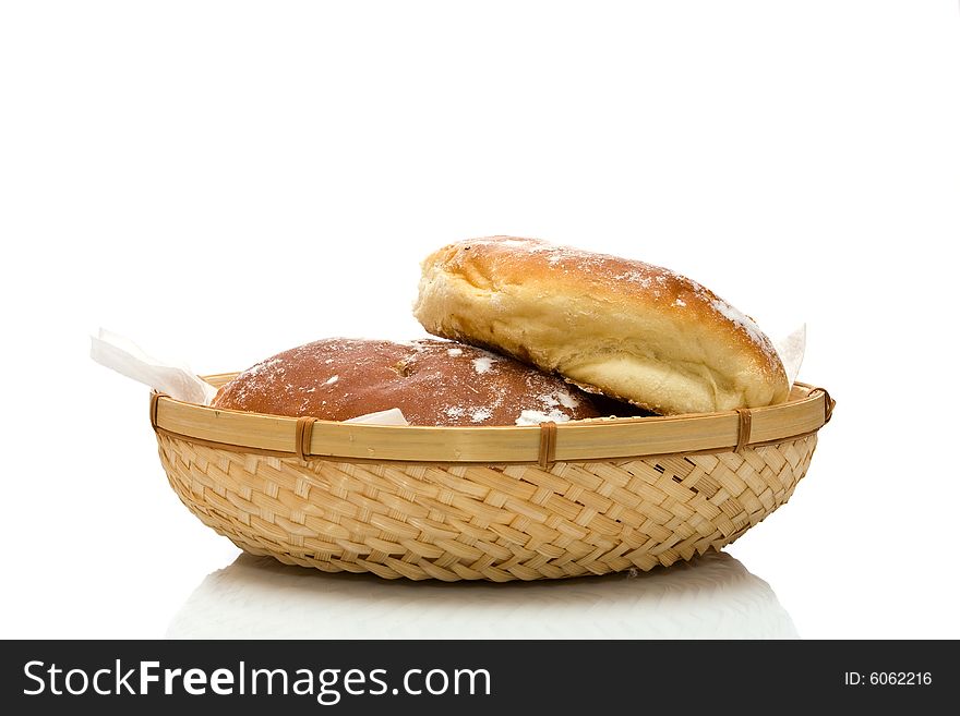 Fresh baked rolls on white background