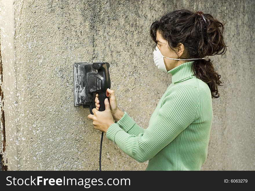 Woman Using A Sander - Horizontal