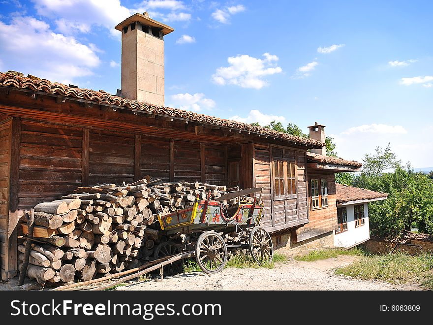 Wooden house with cart in Jeravna, Bulgaria