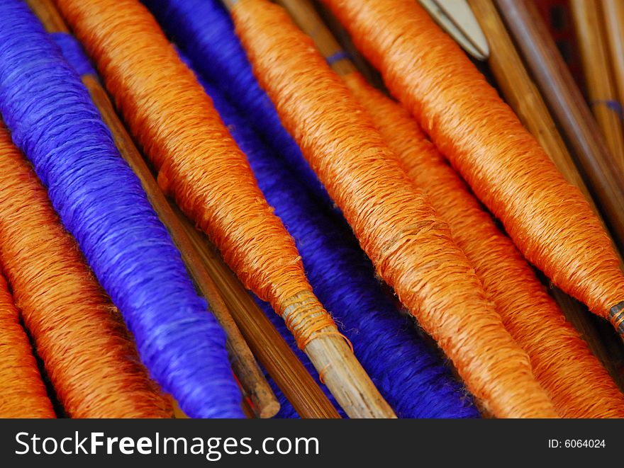 Vibrant details of silk spools in basket. Vibrant details of silk spools in basket