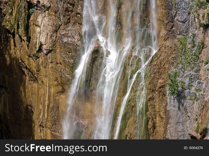 Waterfall with brown and gray rock