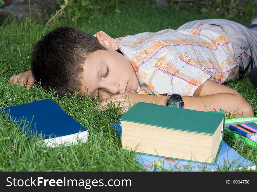The sleeping student with the books  outdoor