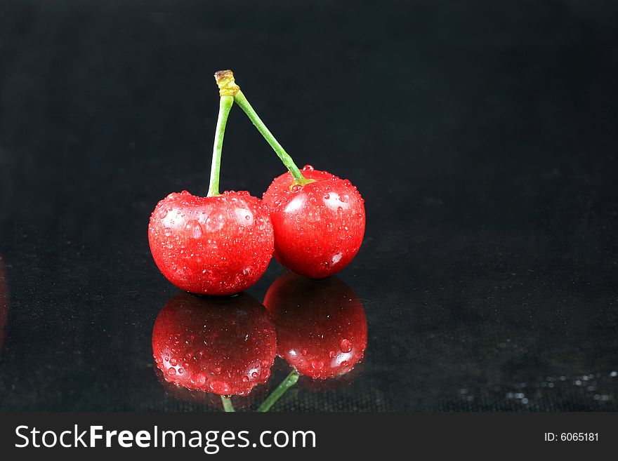 Fresh Cherry with Dew on Dark Glass. Fresh Cherry with Dew on Dark Glass
