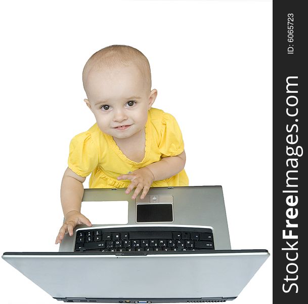 Little baby girl with laptop sitting and looking on top, isolated. Little baby girl with laptop sitting and looking on top, isolated