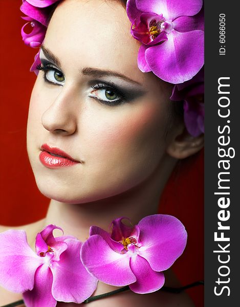 Beauty portrait of a young beautiful woman with flowers. Beauty portrait of a young beautiful woman with flowers