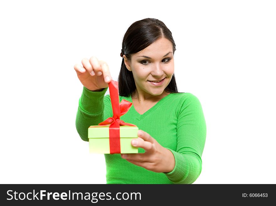 Attractive brunette woman holding gift on white background. Attractive brunette woman holding gift on white background