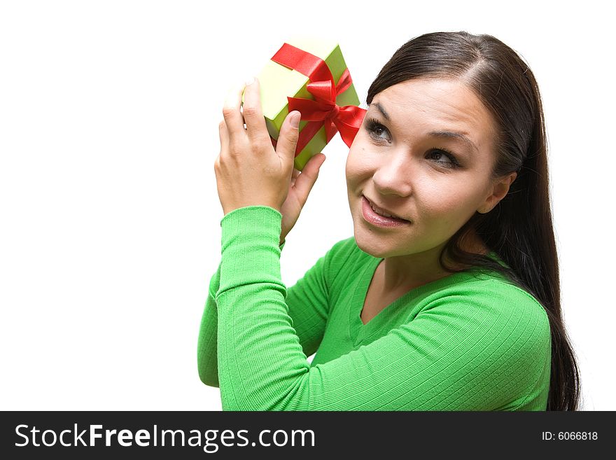 Attractive brunette woman holding gift on white background. Attractive brunette woman holding gift on white background