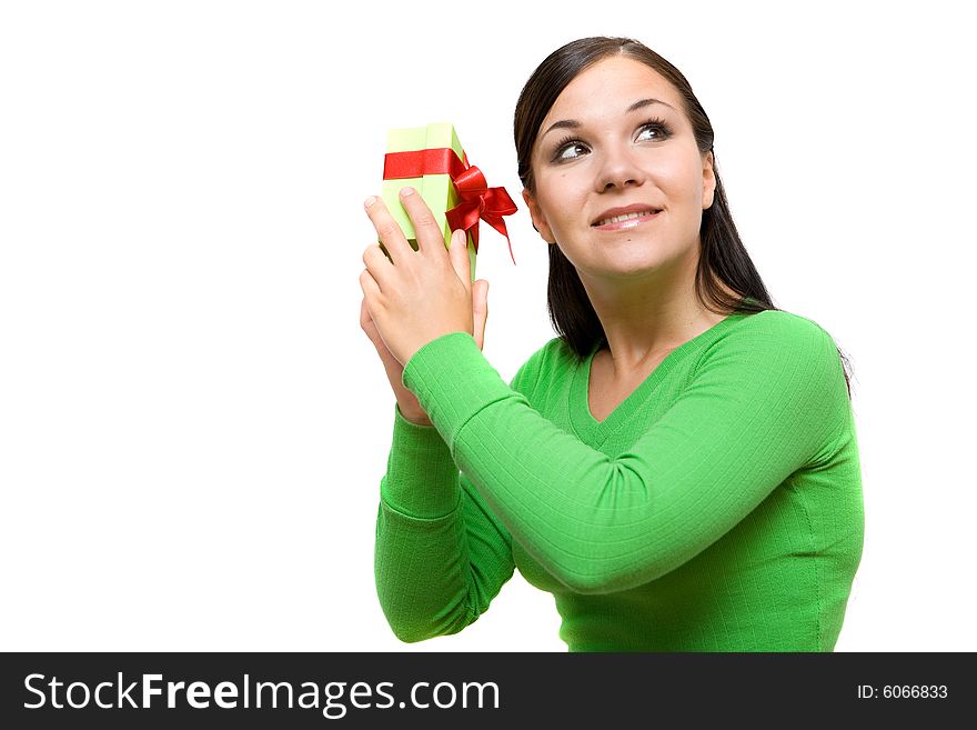 Attractive brunette woman holding gift on white background. Attractive brunette woman holding gift on white background