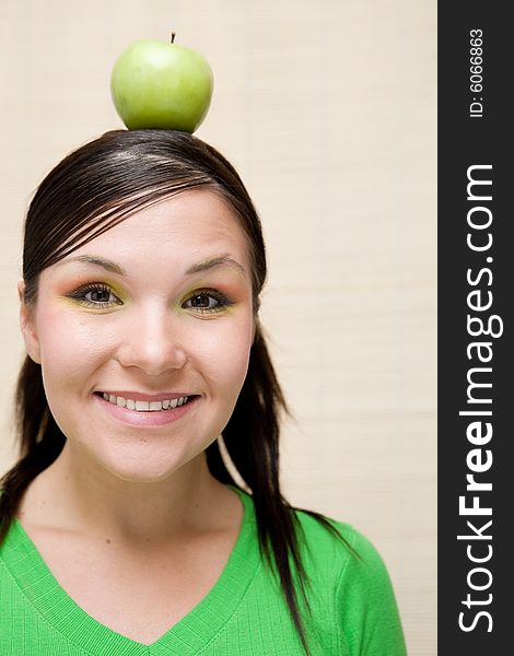 Attractive brunette woman holding apple. Attractive brunette woman holding apple