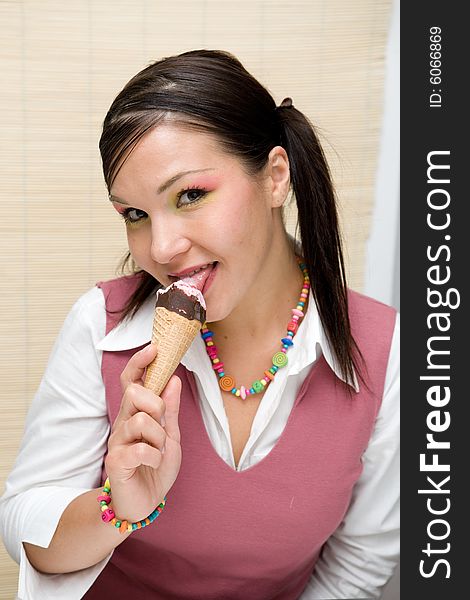 Attractive brunette woman with ice cream. Attractive brunette woman with ice cream