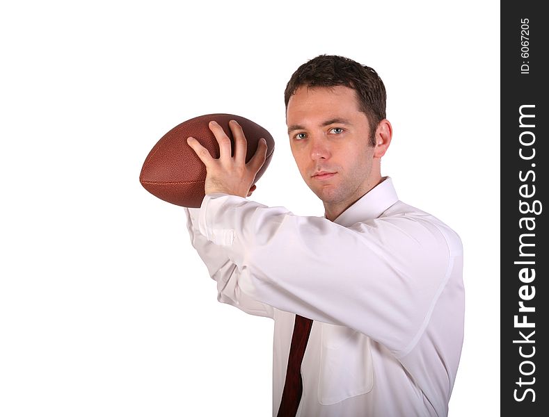 Young businessman in white shirt posing with football. Young businessman in white shirt posing with football