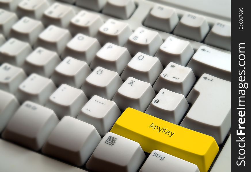 A computer keyboard with an yellow AnyKey