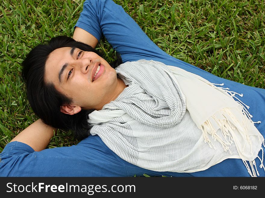 Man Laying On The Grass