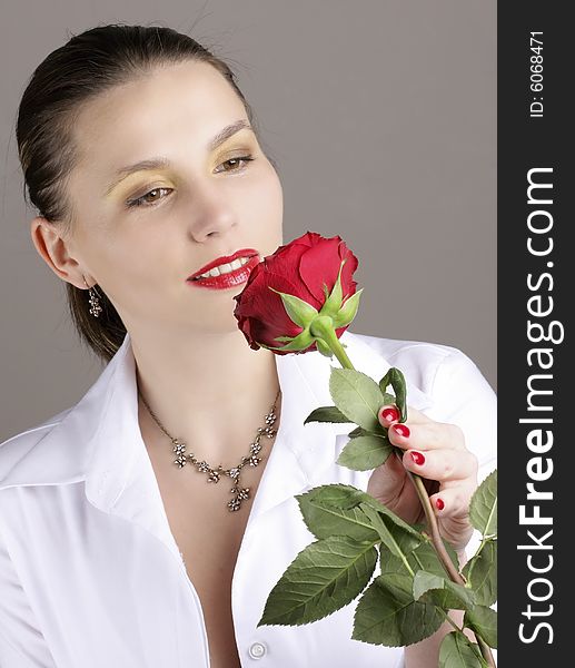 Beautiful girl with red rose