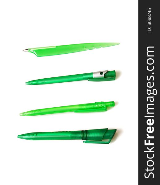 Green pens on white ground