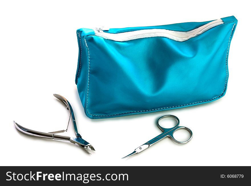 Blue beautician and nail scissors - manicure set on isolated background. Blue beautician and nail scissors - manicure set on isolated background.