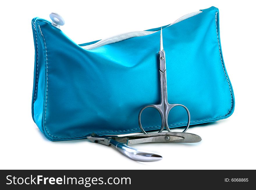 Blue beautician and nail scissors - manicure set on isolated background. Blue beautician and nail scissors - manicure set on isolated background.