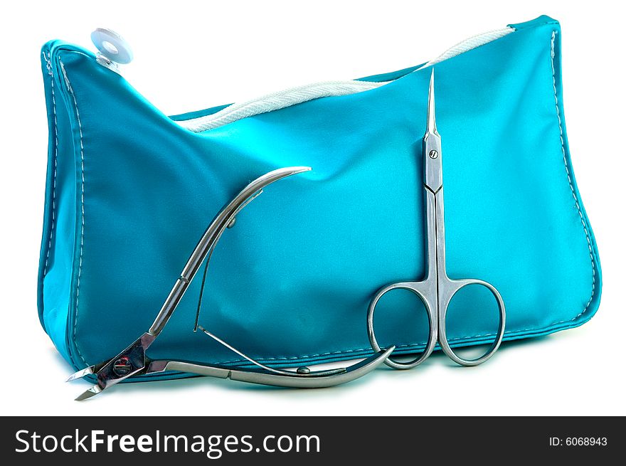 Blue beautician and nail scissors - manicure set on isolated background. Blue beautician and nail scissors - manicure set on isolated background.