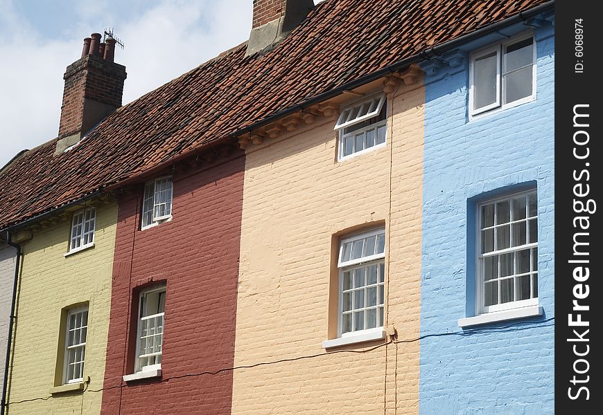 Multicolored houses in a street , stripy. Multicolored houses in a street , stripy.