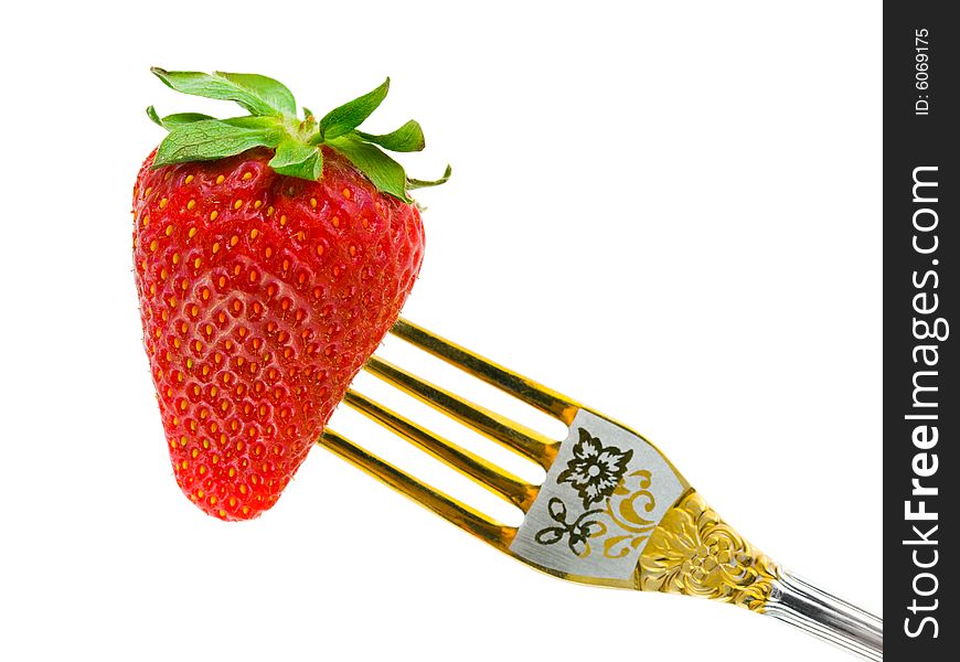 Strawberry and fork isolated on white background