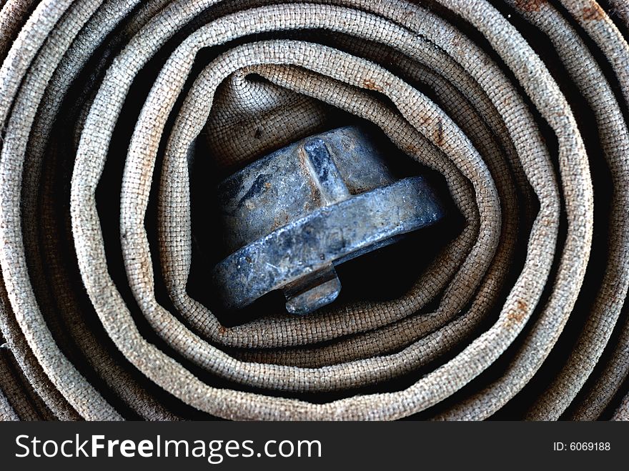 Rolled Old Fire-hose with connector