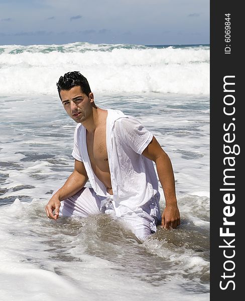 Man In The Seaside Wearing White Clothes