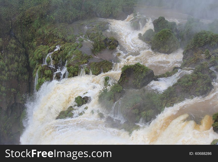 Iguazu falls are waterfalls of the Iguazu River on the border of the Argentine province of Misiones and the Brazilian state of Paraná. Surroned by rainforest with amazing flora and fauna. Iguazu falls are waterfalls of the Iguazu River on the border of the Argentine province of Misiones and the Brazilian state of Paraná. Surroned by rainforest with amazing flora and fauna.