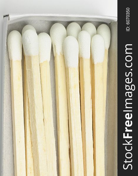 Wooden match sticks in paper matchbox - macro. Wooden match sticks in paper matchbox - macro