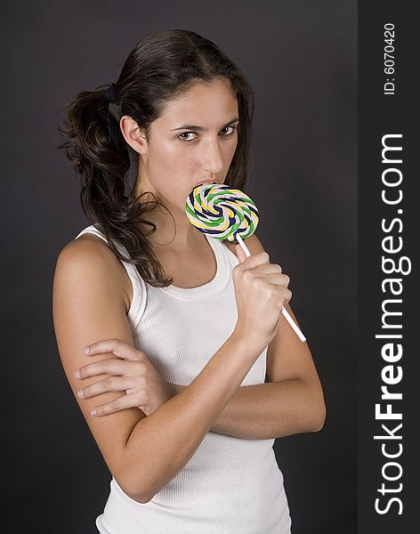 Young Girl Eating A Lolly Pop