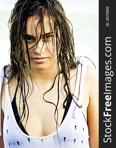 Wet hair woman staring sensually at camera.