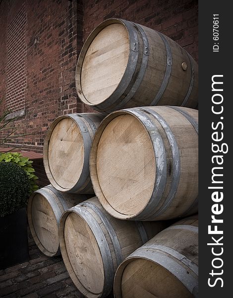 A stack of old wooden wine barrels