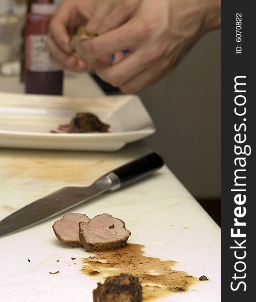 Chef preparing Sliced pork loin