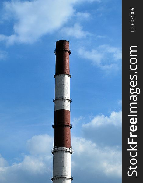 Manufacturing chimney on blue sky