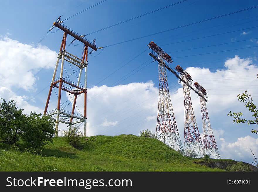 Electric main in the field against the cloudy sky. Electric main in the field against the cloudy sky