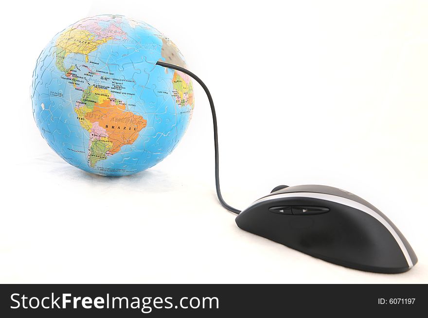 Isolated computer mouse and a globe shot over white background. Isolated computer mouse and a globe shot over white background