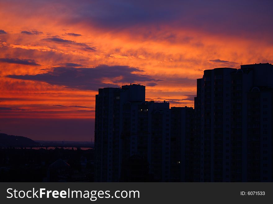 Buildings and sunset sky. Evening silhouettes.