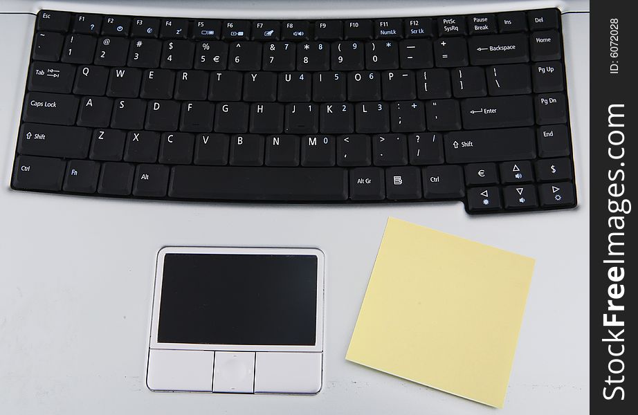 Close up shot of blank sticky note on a laptop